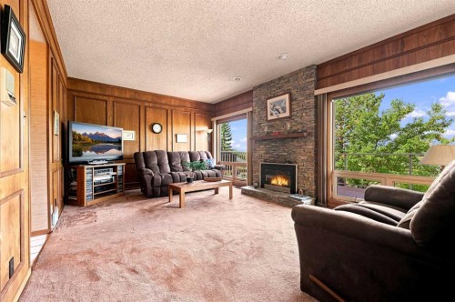 1148 Edgemont Road Nw, Calgary, AB - Indoor Photo Showing Living Room With Fireplace