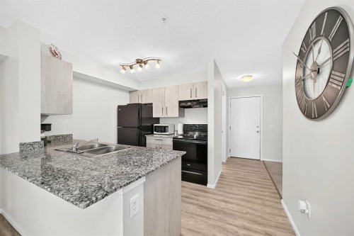 3222-4641 128 Avenue Ne, Calgary, AB - Indoor Photo Showing Kitchen With Double Sink With Upgraded Kitchen