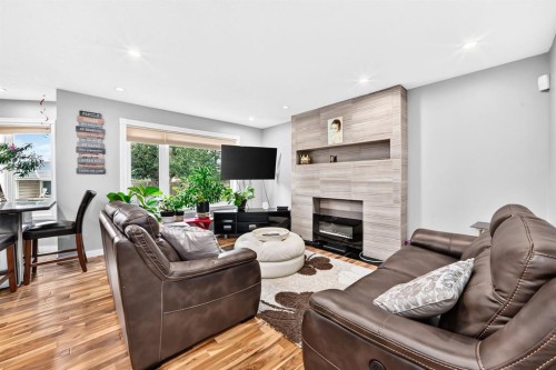 139 Hawkville Close Nw, Calgary, AB - Indoor Photo Showing Living Room With Fireplace