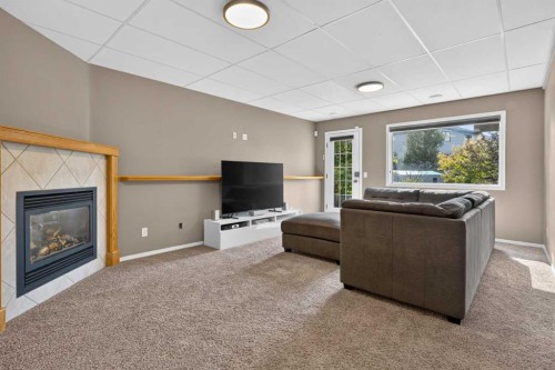 4 Citadel Manor Nw, Calgary, AB - Indoor Photo Showing Living Room With Fireplace