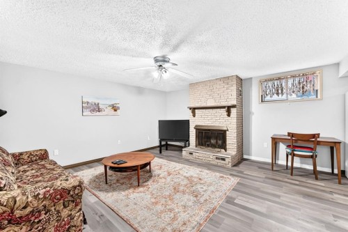1949 Lytton Crescent Se, Calgary, AB - Indoor Photo Showing Living Room With Fireplace
