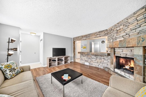 1949 Lytton Crescent Se, Calgary, AB - Indoor Photo Showing Living Room With Fireplace