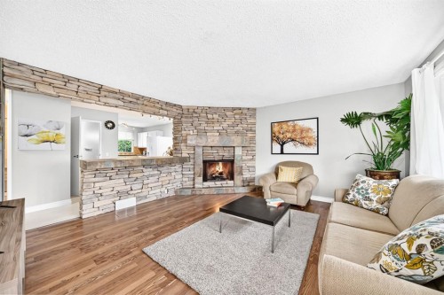 1949 Lytton Crescent Se, Calgary, AB - Indoor Photo Showing Living Room With Fireplace