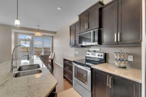 288 Evansborough Way Nw, Calgary, AB - Indoor Photo Showing Kitchen With Stainless Steel Kitchen With Double Sink With Upgraded Kitchen