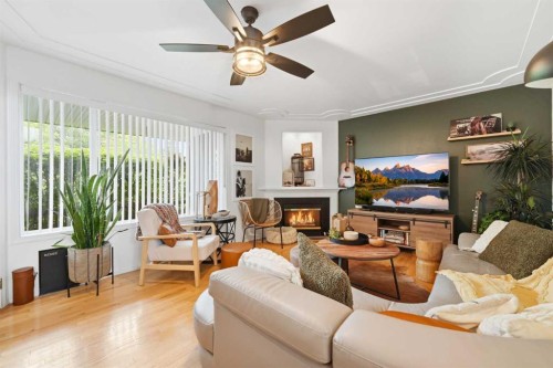 42H Green Meadow Crescent, Strathmore, AB - Indoor Photo Showing Living Room With Fireplace