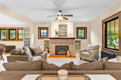 4730 50 Street, Olds, AB - Indoor Photo Showing Living Room With Fireplace