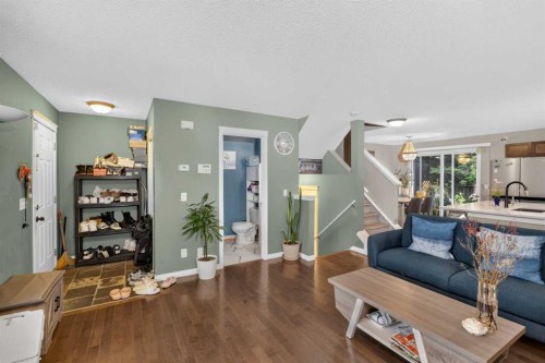 66 Panatella Park Nw, Calgary, AB - Indoor Photo Showing Living Room