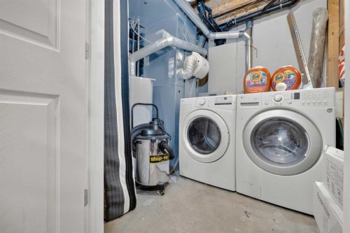 66 Panatella Park Nw, Calgary, AB - Indoor Photo Showing Laundry Room