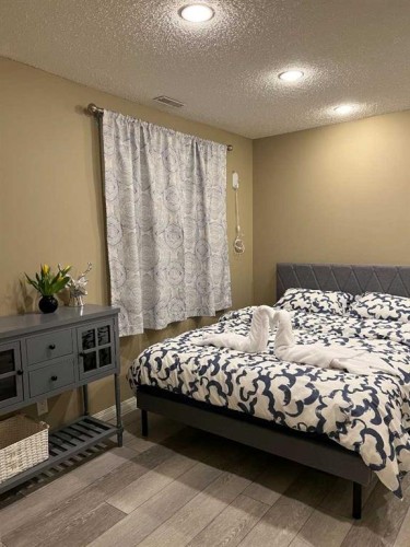 66 Panatella Park Nw, Calgary, AB - Indoor Photo Showing Bedroom