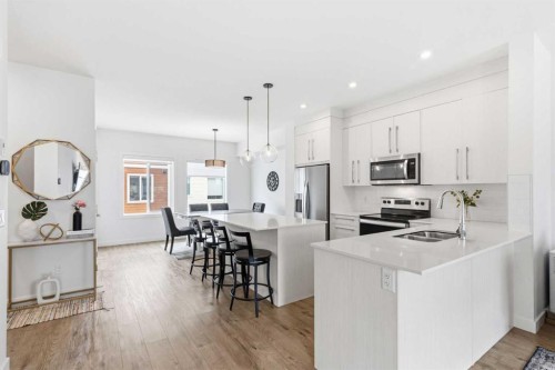 602-335 Creekside Boulevard Sw, Calgary, AB - Indoor Photo Showing Kitchen With Stainless Steel Kitchen With Double Sink With Upgraded Kitchen