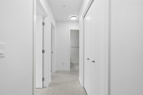 602-335 Creekside Boulevard Sw, Calgary, AB - Indoor Photo Showing Other Room
