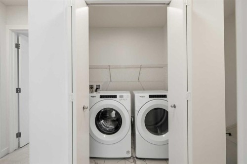 602-335 Creekside Boulevard Sw, Calgary, AB - Indoor Photo Showing Laundry Room