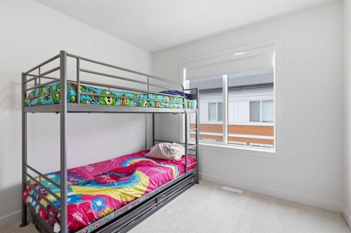 602-335 Creekside Boulevard Sw, Calgary, AB - Indoor Photo Showing Bedroom