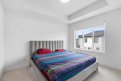 602-335 Creekside Boulevard Sw, Calgary, AB - Indoor Photo Showing Bedroom