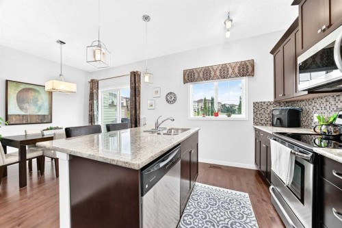 302 Sunset Point, Cochrane, AB - Indoor Photo Showing Kitchen With Upgraded Kitchen