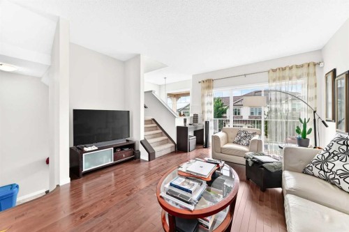 302 Sunset Point, Cochrane, AB - Indoor Photo Showing Living Room