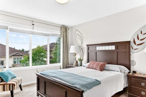 302 Sunset Point, Cochrane, AB - Indoor Photo Showing Bedroom