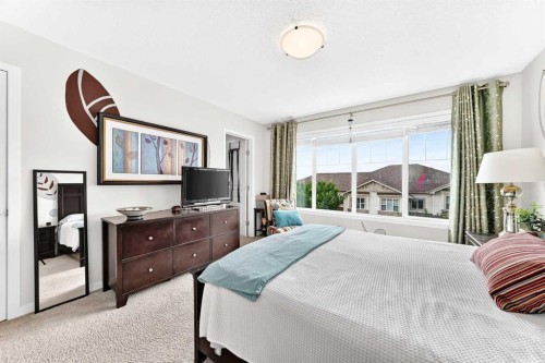 302 Sunset Point, Cochrane, AB - Indoor Photo Showing Bedroom
