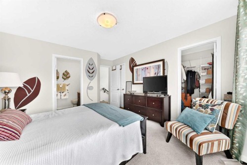 302 Sunset Point, Cochrane, AB - Indoor Photo Showing Bedroom
