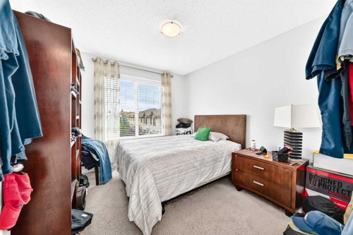 302 Sunset Point, Cochrane, AB - Indoor Photo Showing Bedroom