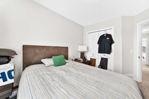 302 Sunset Point, Cochrane, AB - Indoor Photo Showing Bedroom