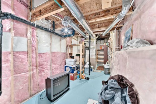 302 Sunset Point, Cochrane, AB - Indoor Photo Showing Basement