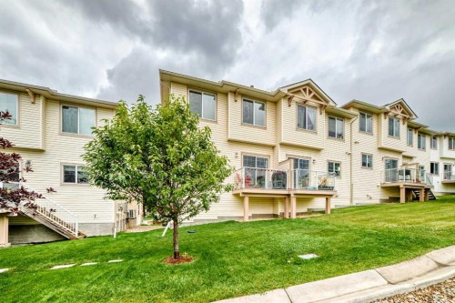 302 Sunset Point, Cochrane, AB - Outdoor With Balcony