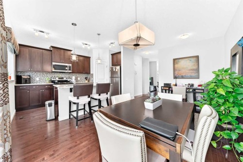 302 Sunset Point, Cochrane, AB - Indoor Photo Showing Kitchen With Stainless Steel Kitchen With Upgraded Kitchen