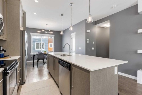 17-111 Rainbow Falls Gate, Chestermere, AB - Indoor Photo Showing Kitchen With Double Sink With Upgraded Kitchen