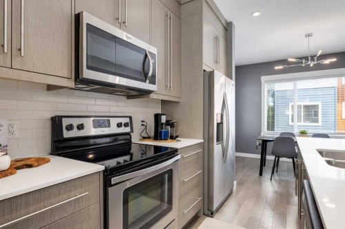 17-111 Rainbow Falls Gate, Chestermere, AB - Indoor Photo Showing Kitchen With Upgraded Kitchen