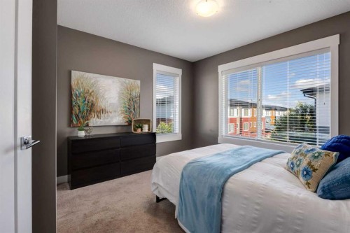 17-111 Rainbow Falls Gate, Chestermere, AB - Indoor Photo Showing Bedroom