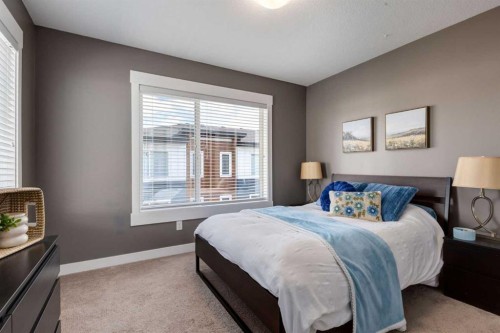 17-111 Rainbow Falls Gate, Chestermere, AB - Indoor Photo Showing Bedroom