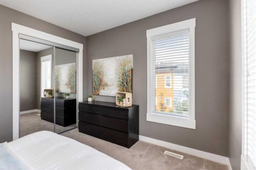 17-111 Rainbow Falls Gate, Chestermere, AB - Indoor Photo Showing Bedroom