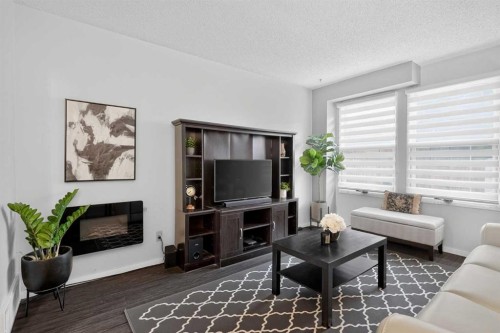 3881 Fonda Way Se, Calgary, AB - Indoor Photo Showing Living Room With Fireplace