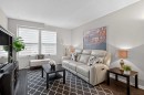 3881 Fonda Way Se, Calgary, AB  - Indoor Photo Showing Living Room With Fireplace 