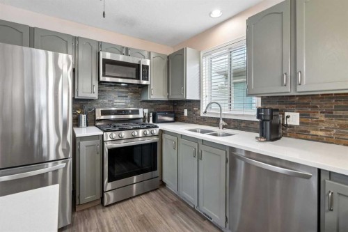 1840 33 Avenue Sw, Calgary, AB - Indoor Photo Showing Kitchen With Stainless Steel Kitchen With Double Sink
