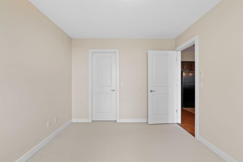 407-201 Sunset Drive, Cochrane, AB - Indoor Photo Showing Other Room
