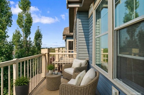 407-201 Sunset Drive, Cochrane, AB - Outdoor With Balcony