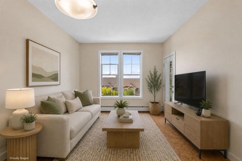 407-201 Sunset Drive, Cochrane, AB - Indoor Photo Showing Living Room