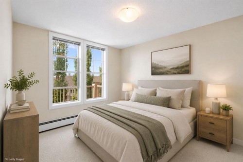 407-201 Sunset Drive, Cochrane, AB - Indoor Photo Showing Bedroom