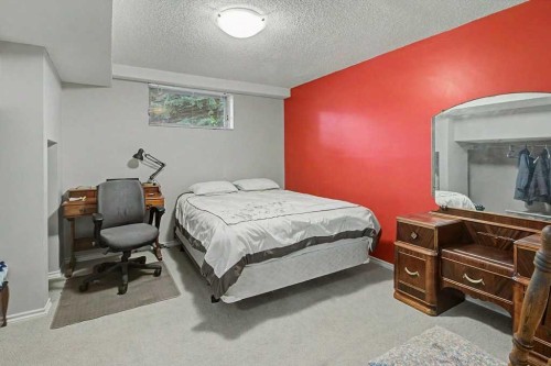 43 Riverside Road Se, Calgary, AB - Indoor Photo Showing Bedroom