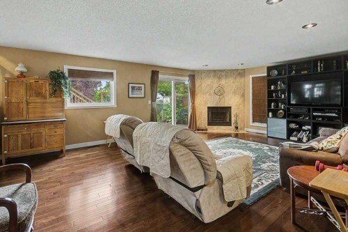 43 Riverside Road Se, Calgary, AB - Indoor Photo Showing Living Room With Fireplace