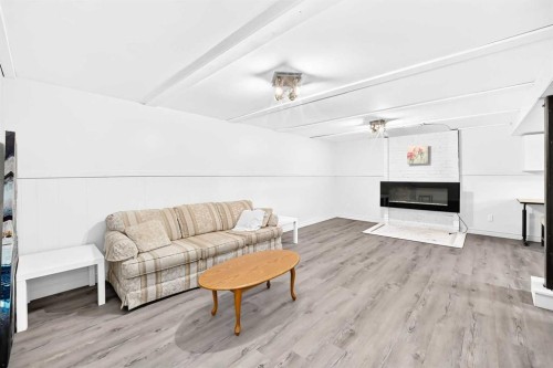 4832 Worcester Drive Sw, Calgary, AB - Indoor Photo Showing Living Room With Fireplace