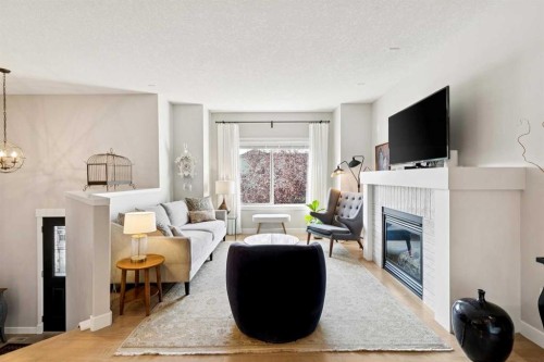 9062 14 Avenue Sw, Calgary, AB - Indoor Photo Showing Living Room With Fireplace