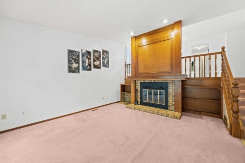 147 Whitlock Close Ne, Calgary, AB - Indoor With Fireplace