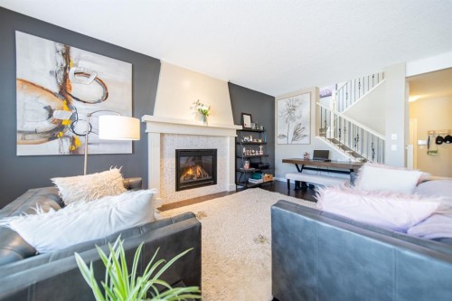 98 Mahogany Passage Se, Calgary, AB - Indoor Photo Showing Living Room With Fireplace