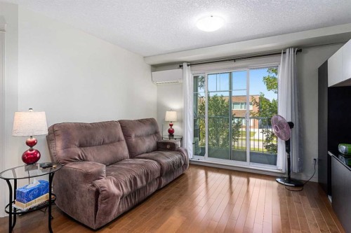 208-304 Cranberry Park Se, Calgary, AB - Indoor Photo Showing Living Room