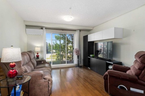 208-304 Cranberry Park Se, Calgary, AB - Indoor Photo Showing Living Room
