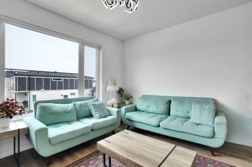 241 Saddlepeace Crescent Ne, Calgary, AB - Indoor Photo Showing Living Room