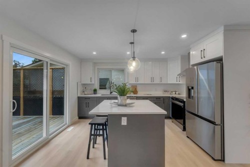 104 Oakmoor Place Sw, Calgary, AB - Indoor Photo Showing Kitchen With Stainless Steel Kitchen With Upgraded Kitchen
